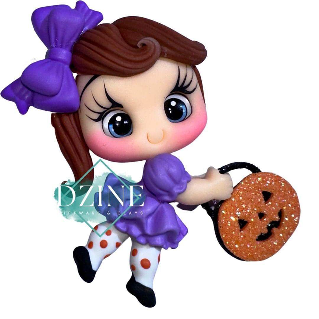 Cute girl with pumpkin bag purple bow