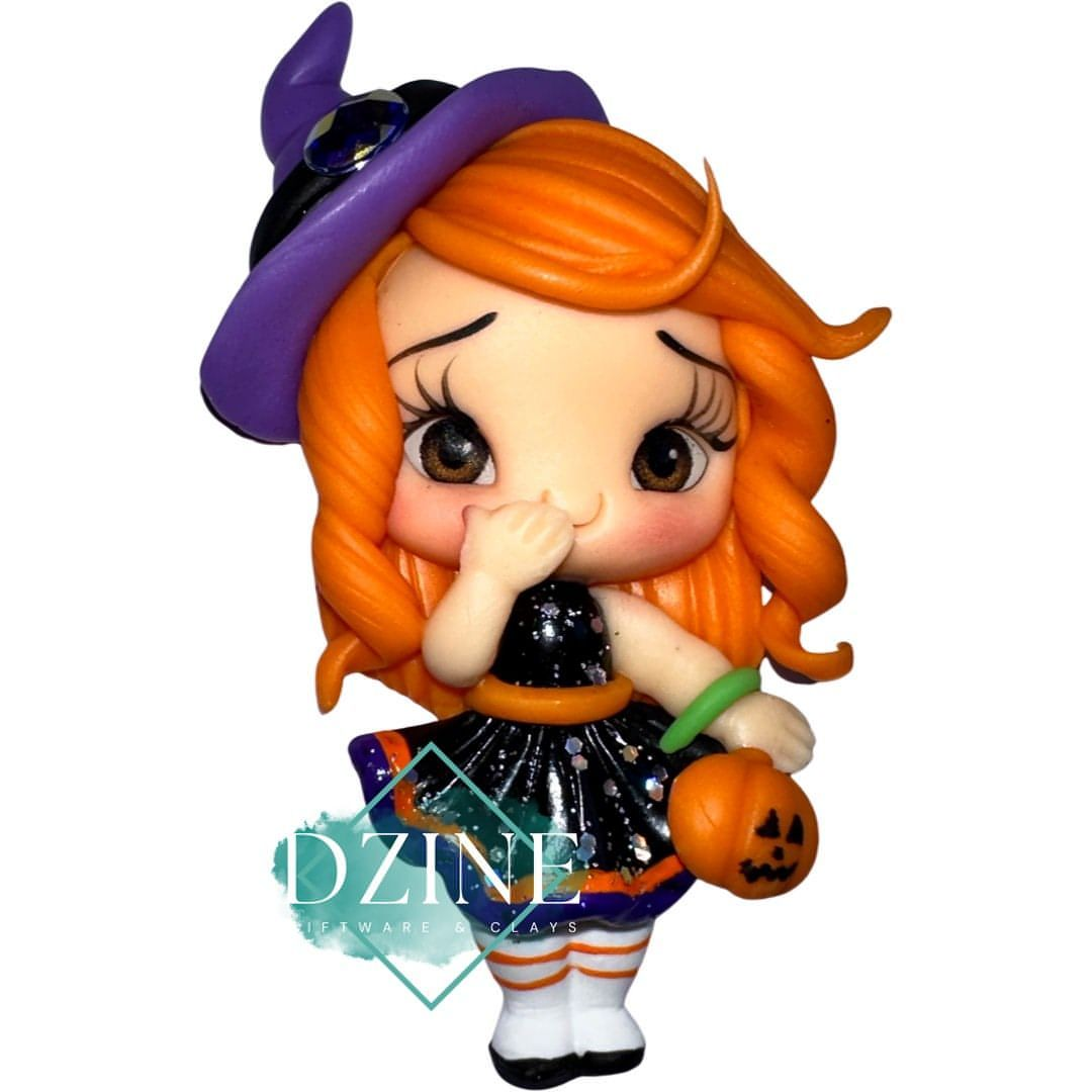 Cute witch with pumpkin bag
